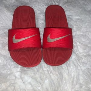 Red toddler Nike slides